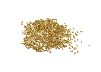 Golden sprinkles isolated on white background top view. Sweet golden glaze decoration or chocolate vermicelli