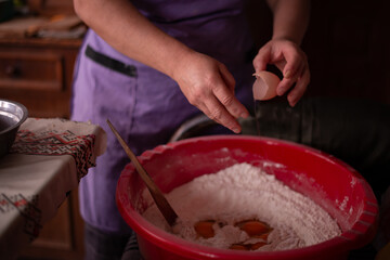 housewife mixing flour with her hands in the bowl. preparing ingredients for traditional homemade cakes