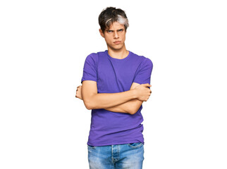 Young hispanic man wearing casual clothes skeptic and nervous, disapproving expression on face with crossed arms. negative person.