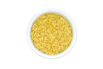 Millet flakes in a bowl isolated on white bacground.