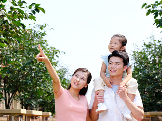 Happy family of three in the outdoor group photo