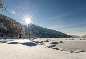 Sun rising over a snowny hill in the alps 4