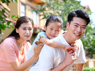 Happy family of three in the outdoor group photo