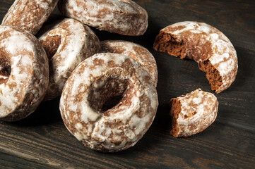 Homemade round gingerbread cookies with icing on a vintage table. Idea for a delicious breakfast or dinner. Top view