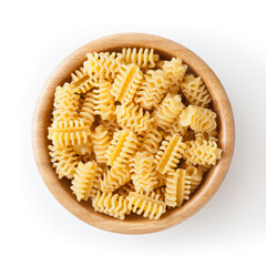Uncooked radiatori pasta in wooden bowl isolated on white background with clipping path
