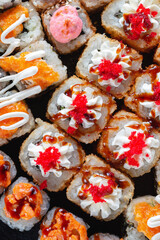 Sushi rolls with sauce close-up