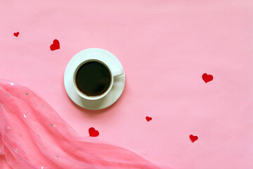 ladies pink background with coffee cup and red hearts  , top view