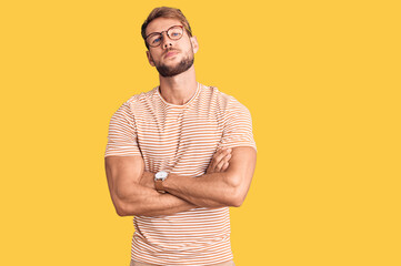 Young caucasian man wearing casual clothes and glasses skeptic and nervous, disapproving expression...