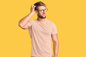 Young caucasian man wearing casual clothes and glasses confuse and wondering about question....