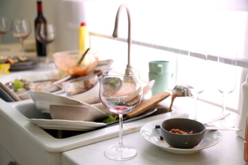 Dirty dishes in kitchen after new year party