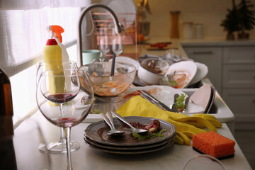 Dirty dishes in kitchen after new year party