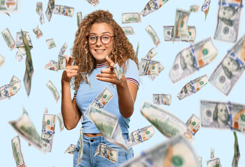 Beautiful caucasian teenager girl wearing casual clothes and glasses pointing fingers to camera...