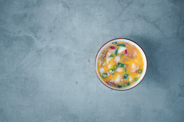 Raw egg with chopped chilli and red onion