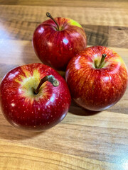 red apples on wooden table
