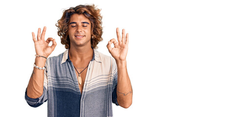Young hispanic man wearing summer style relax and smiling with eyes closed doing meditation gesture with fingers. yoga concept.