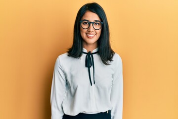 Beautiful asian young woman wearing business shirt with a happy and cool smile on face. lucky person.