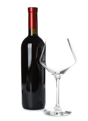 Bottle of red wine and glass on white background