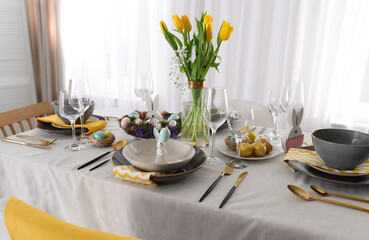 Beautiful Easter table setting with festive decor indoors