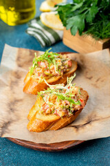 Bruschetta on burnt paper filmed for the menu