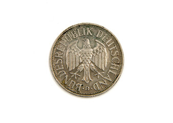 Old coin on white background