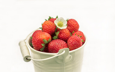 Close-up strawberries in a bucket, summer in the village, harvest