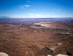 Fototapeta premium Stupendous views of Canyonlands National Park from Dead Horse Point State Park in Utah on a partly cloudy day