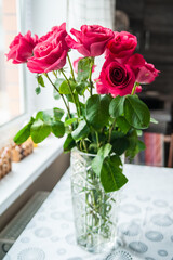 Beautiful flower bouquet of pink rose. Big bouquet of roses in vase on table.