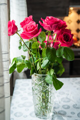 Beautiful flower bouquet of pink rose. Big bouquet of roses in vase on table.