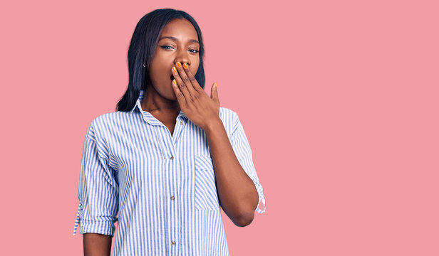 Young african american woman wearing casual clothes bored yawning tired covering mouth with hand. restless and sleepiness.