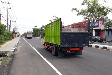 truck on the highway, or truk lewat di jalan, Magelang, Jawa Tengah, Indonesia