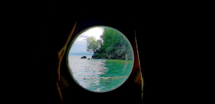 Shore of Lake Baikal. Porthole View.