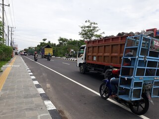 truck on a highway, or truk lewat di jalan, Magelang, Jawa Tengah, Indonesia