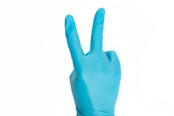 Doctor's hand showed victory sign in blue medical (surgical) gloves on white background. Space for text.