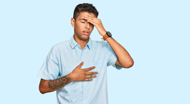 Young handsome african american man wearing casual clothes touching forehead for illness and fever, flu and cold, virus sick