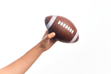 Hand of caucasian young sporty man holding football ball over isolated white background
