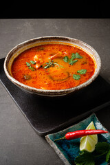 spicy asian soup with microgreens