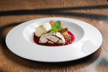 Grilled camembert cheese with cranberry jam and pear