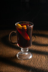 Mulled wine with orange and star anise in a clear glass