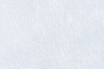 Ice background texture and snow surface with marks and lines from skating. Ice hockey rink, arena or stadium from top view. Light blue frost wallpaper. Rough frosty traces from winter sport. Icy lake.