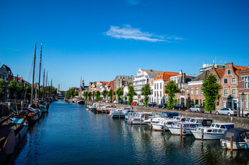 Rotterdam, Netherlands - July 5, 2019: Boats docked in the canal in Delfshaven district of Rotterdam