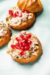 canape with meat salad and pomegranate seeds