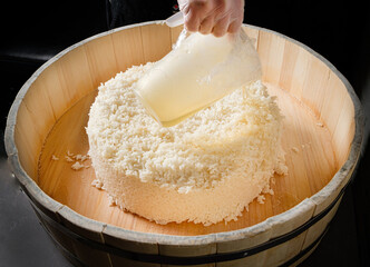 chef cooking rice for sushi