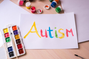 Creative design for april 2, autism world awareness day.  Painting word autism with paints