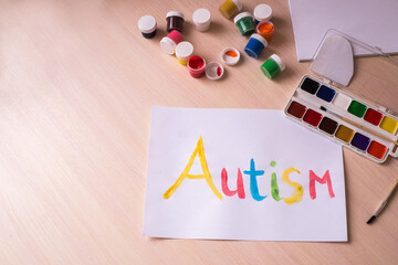 Creative design for april 2, autism world awareness day.  Painting word autism with paints