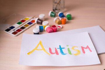 Creative design for april 2, autism world awareness day.  Painting word autism with paints