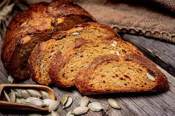 Pumpkin bread. Freshly baked traditional bread on wooden table.