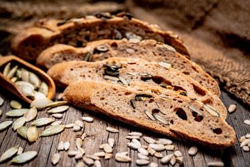Freshly baked traditional bread on wooden table.