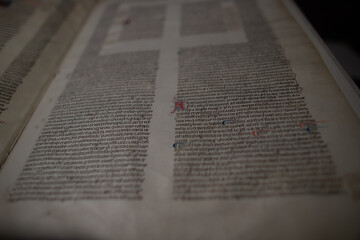 Medieval manuscript hand written on vellum with rubricated and illuminated initials, from a religious text from the C13th. 
