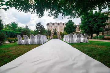 general view of the decoration of the wedding ceremony in the garden in the air. wedding decor