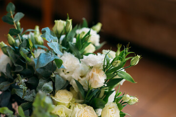 beautiful lush bouquet of white roses and eustomas for decorating a wedding celebration